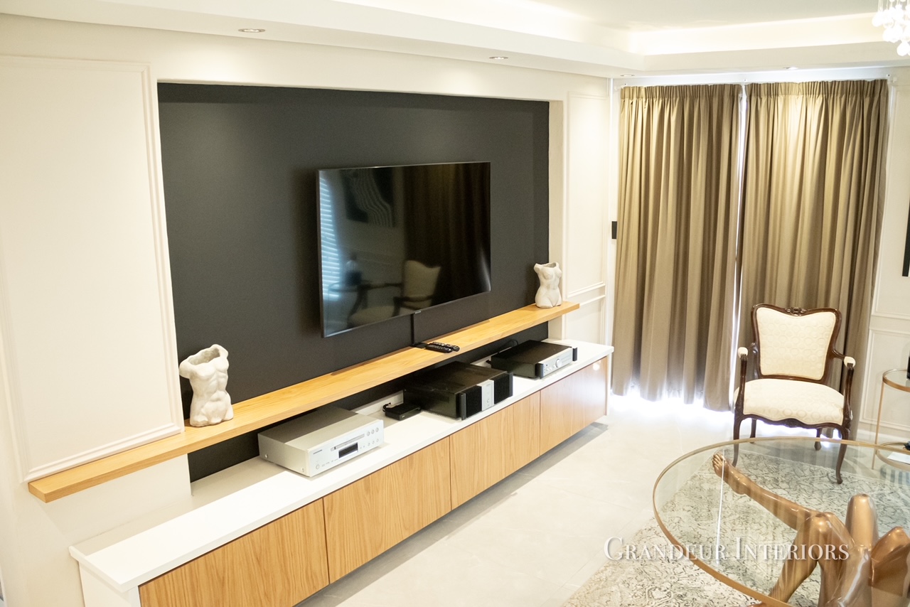 Custom timber and lacquer media unit with dark feature wall