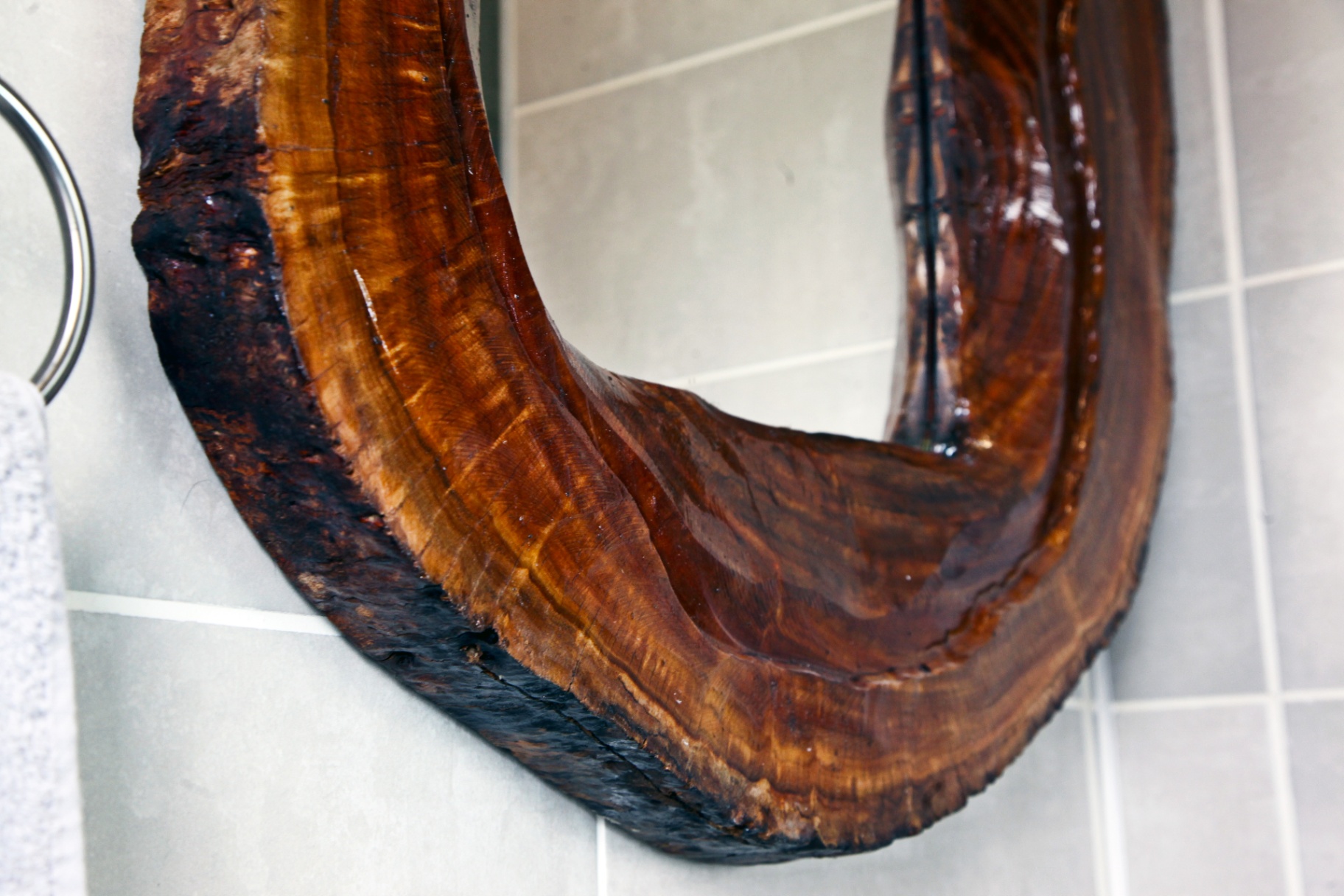 Custom live-edge timber mirror in guest bathroom