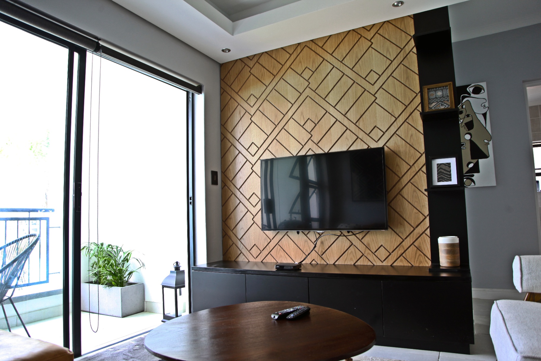 Custom geometric timber feature wall with media console